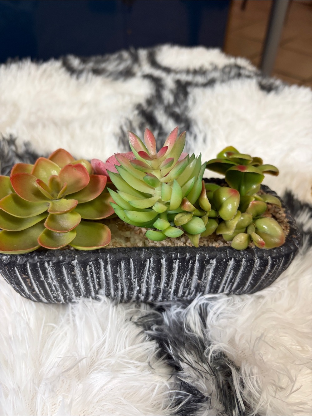 # 60.Textured Black Planter with Green and Pink Faux Succulents